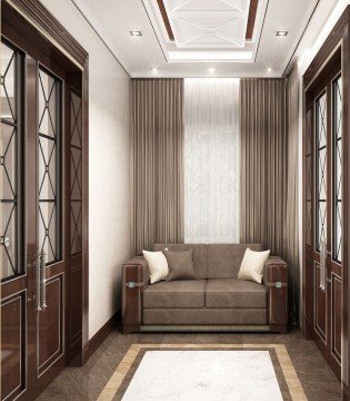 This picture shows a luxurious master bedroom designed by Antonovich Design. The room is decorated with ornate furniture, such as a white tufted headboard and matching bed frame, a chaise lounge chair in front of the bed, and a large dresser with mirrored drawers. The walls are covered in a beige and white damask wallpaper that adds texture to the space. The ceiling is made up of wood beams that give the room a homey feel. Light fixtures hang in the corners of the room and spotlights highlight the decor.