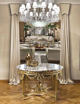 A majestic and beautiful formal dining room with luxurious gold accents and a high vaulted ceiling.