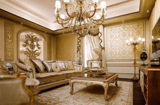 Luxurious and elegant interior with white walls, black furniture, and luxurious gold decoration.