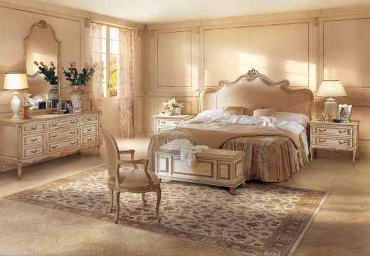 Modern luxurious bedroom in royal style, with ornate furniture, elegant chandelier, rich velvet drapes and gilded details.