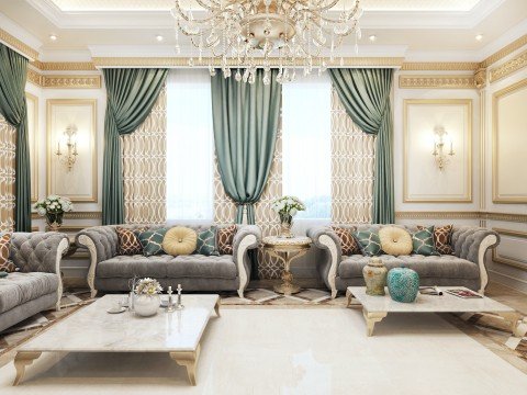 This picture shows a modern living room with a large white sofa. The space is decorated with a large wall mirror and a decorative painting above the fireplace. There is a white rug on the floor, and two matching armchairs which provide seating options. The walls are painted in a light color, which helps to create a bright, airy atmosphere.