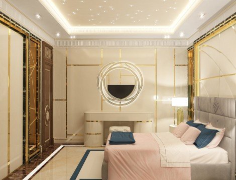 This is a picture of an exquisite bedroom design by Antonovich Design. The picture features a modern style with a statement wall finished in black marble and a white ceiling decorated with golden trim accents. The main feature of the design is the four-poster bed with its luxurious draped fabric canopy and curtains, and gold trim details. The bed is flanked by two nightstands with gold trim accents, as well as a tall dresser with gold trim detailing. Softly textured beige rugs are seen throughout the room, and a built-in fireplace adds warmth and ambiance to the