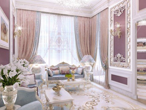 A luxurious living area with a grand spiral staircase, lush cream furniture, and soft pink accents!
