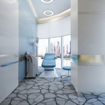 A stylish white-themed lobby design with a touch of gold and cream elements, highlighting the beauty of marble floors.