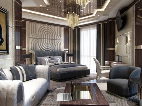 This picture shows an elegant modern living room. It features a contemporary seating area with two off-white sofas arranged around a glass coffee table. The room also has a charcoal-gray sectional sofa and a pair of white armchairs. Additionally, the room is decorated with a rug, a large abstract painting, and several black accent pieces.