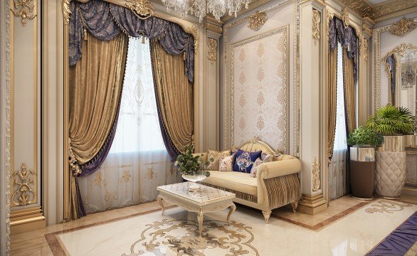 The picture shows an ornately decorated bedroom. The walls are lavishly painted with a cream color and are adorned with intricate gold designs. The furniture is a deep red, with gold-embellished accents. The room also features a decorative chandelier, patterned rugs, and a large wall-mounted mirror with beveled edges.