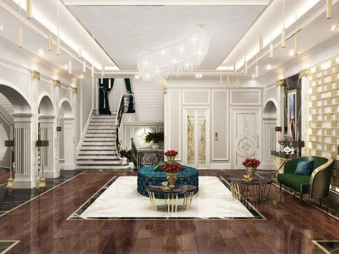 This picture shows a luxurious living room with a classic design. The room features a white and gold color palette, with a comfortable beige sofa and armchairs arranged around a statement gold coffee table. There are gold framed wall mirrors and a large crystal chandelier hanging from the ceiling, giving the room an elegant and inviting atmosphere.
