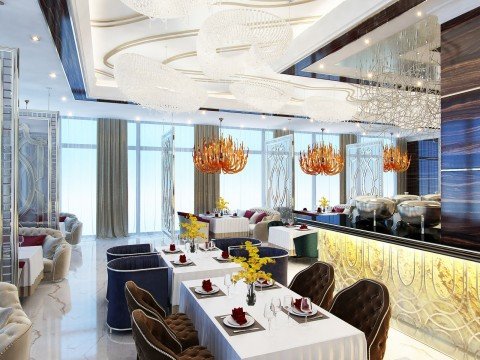 A modern luxury interior design with an ornate chandelier, gold accents and comfortable furniture for the perfect look.