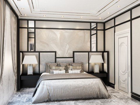 Luxury bedroom boasting plush details such as a crystal chandelier, gold framed mirrors, and an ornate headboard.