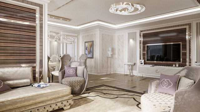 This picture shows an elegant and luxurious living room. The room features a white and gold color scheme with a large white sofa and armchairs in the center, decorated with small pillows. A regal looking chandelier hangs from the ceiling, while a white and gold intricate rug covers the floor. Large windows let in plenty of light, accentuating the lavish details of the room. The walls are adorned with beautiful paintings adding to the luxe atmosphere.
