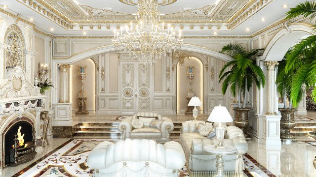 Modern luxury lobby featuring luxurious furniture, marble flooring and pillars, high arched ceiling with a chandelier, and beautiful art pieces.