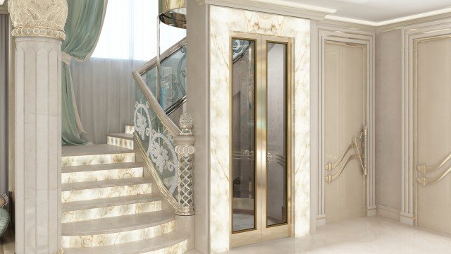 This picture shows a luxurious grand stairway, with marble balusters and a mirrored handrail. The steps are covered in an elegant patterned carpet, and the walls are adorned with intricate gold trim. Artwork and chandeliers adorn the walls, giving the stairwell a warm and inviting feeling. A large mirror is mounted at the top of the stairs and reflects the beauty of the entire space.