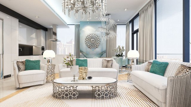 This picture is of a lavish living room with luxury furniture, including an ornate white sofa and matching upholstered armchairs. In the center of the room is a large white rug with a traditional pattern, and there is an elegant crystal chandelier hung above it. The walls are a soft beige color, and the room is illuminated with ambient lighting from floor-to-ceiling windows. There are also two modern black side tables with gold accents.