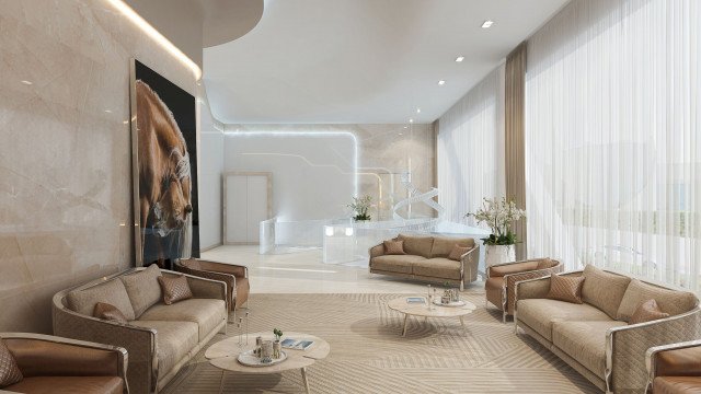 Modern interior consisting of cream-colored walls, white sectional sofas, center coffee table, abstract art on walls and pendant lights overhead.