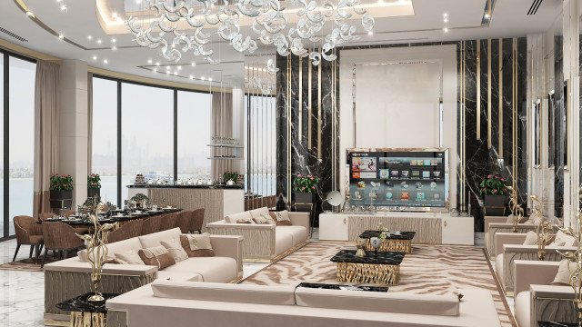 This picture is showing an elegant and luxurious modern-style interior design. The walls have been painted a light beige color with a large, intricately designed crystal chandelier in the center of the room. The floor is also tiled in light beige and brown color variations, with a stylish white and gold area rug at the center. In the corner of the room, there is a large brown leather sofa accompanied by two black leather armchairs. The furniture is complemented by several similarly designed white and black cushions and side tables. To complete the look, several elegant pieces of