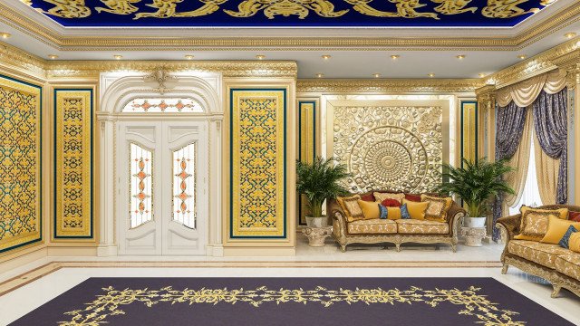 This picture shows a luxurious living room. It features an ornate white and gold sofa set against a backdrop of an intricately carved dark wooden wall panel. There is a stone-detailed fireplace, with a black and gold mantel, to the right. The floor is covered in a light-colored rug. A large gold framed painting is hung above the sofa and a crystal chandelier hangs from the ceiling. A marble-topped side table stands near the fireplace and a tall corner display cabinet is seen in the background.