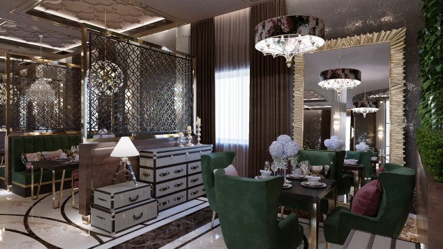 The picture shows a modern, luxurious dining room with gray walls, golden accents, and elaborate lighting fixtures. The room features a white table with sleek black chairs and intricate glassware. Above the table hangs a large, statement-making chandelier with small bulbs and rows of crystal pieces dangling from it. A long narrow mirror hangs on the wall, and two large gold pendant lamps hang on either side for illumination and decoration.