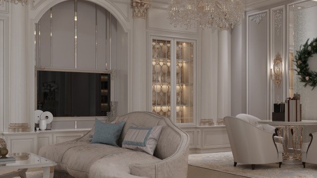 Interior space with neutral color palette featuring a wrap-around sofa and a mirrored wall.