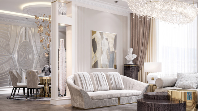This picture is of a luxurious modern living room designed by Antonovich Design. It features a beige and gold color palette, with plush furniture and intricate details. The walls and ceiling are adorned with gold designs, and two floor-to-ceiling windows bring in plenty of natural light. There is a large sectional sofa and chaise lounge, both with beige and gold accents, as well as several accent chairs. A grand piano adds an elegant touch, and a crystal chandelier hangs above the seating area. Overall, this living space exudes luxury and sophistication.