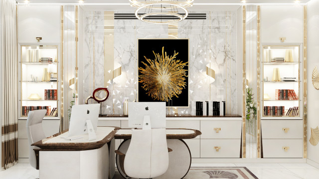 This picture shows an interior design with a white and gold color scheme. The room has a modern and luxurious look, with a sofa and two armchairs upholstered in a white fabric with gold accents. On the right side of the room is a glass coffee table, while on the left is an armchair upholstered in a brown fabric and a wall-mounted television. The floor is marble, which gives the space a sophisticated feel. The overall design of the space is minimal yet elegant.
