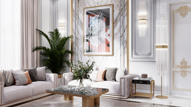 The picture shows a bright, modern living room with white walls and wooden flooring. There is furniture of varying colors including a white sofa and armchair, a grey armchair with ottoman and a wooden coffee table. In the room, there are also plants and decorative accents for added atmosphere.