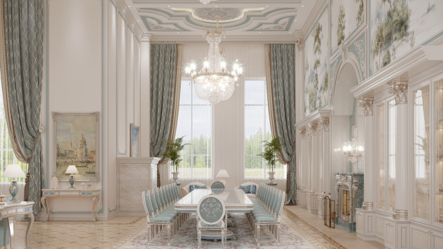 This picture shows a luxurious interior design for a modern living room. It features a comfortable white leather couch with golden accents, a large TV mounted on the wall, and an elegantly-furnished coffee table with a stacked flower arrangement. The walls are decorated with floor-to-ceiling mirrors and a three-dimensional artwork set into the wall. On the opposite side of the room is an ornate rug draped in warm tones and complemented by two stylish armchairs.