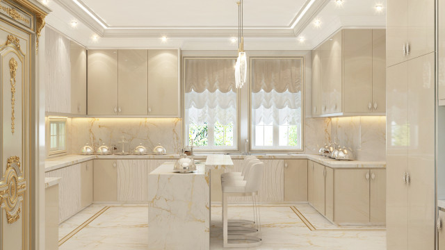 This picture shows a luxury modern kitchen designed by Antonovich Design. The kitchen has sleek white cabinets and drawers, a large island with built-in seating, and stainless steel appliances. The backsplash is decorated with gold-tone mosaic tiles and there are recessed lights in the ceiling. The kitchen also has a built-in oven and an elegant chandelier hanging above the island.