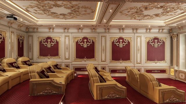 This picture shows a large, luxurious living room with a black, velvet sofa and a gold, mirrored side table. The walls are painted white and gold, while the ceiling is decorated with an intricate chandelier. The room also features two plush velvet armchairs, two circular ottomans, and a glass-top coffee table.