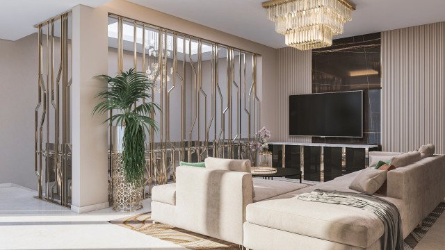 This picture shows a modern living room designed by Antonovich Design. The room features sleek, contemporary furniture and decor that creates a cozy and inviting atmosphere. The walls are painted in a light color and accented with large white curtains that give an airy feel to the space. A large white sectional sofa is situated in the center of the room and flanked by two matching armchairs, while a round glass coffee table adds another touch of modern style. A decorative fireplace is built into one wall and surrounding the fireplace are several framed photographs that add a special touch to the living room.