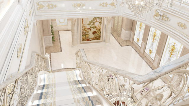 Luxury white and gold interior featuring grand staircase, semi-circular window wall, marble columns, crown molding, and luxurious furnishings.