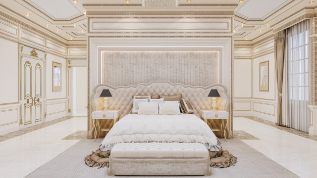 Modern luxurious bedroom comprised of a king-size bed, nightstand, chaise lounge chair and ottoman with a decorative area rug, accenting wall art, and a vanity table.