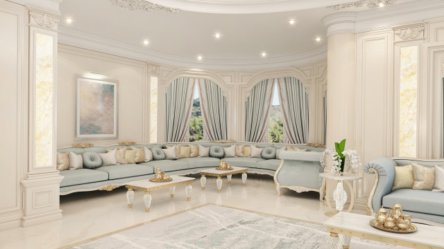 Modern-style living area featuring white walls, grey and beige flooring, a white sofa, and a matching armchair.