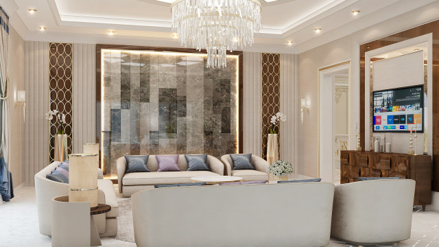 A contemporary white and gold living room design featuring an ornate chandelier, a velvet sofa, side tables with glass lamps, framed artwork, and dark hardwood flooring.