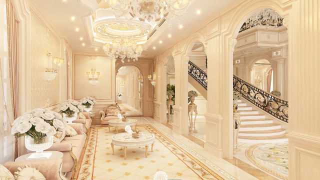 This picture shows an elegant hallway in a house. It is decorated with a marble floor and walls, beautifully detailed columns, and recessed lighting. The large windows allow plenty of natural light to fill the space. At the end of the hallway, there is an exquisite marble staircase.