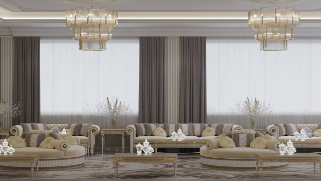 Modern interior design featuring cream-colored walls, light brown furniture with decorative accents, and a gray sectional sofa.