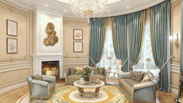 This picture shows a luxurious living room with ornate and elegant decorations. The walls are covered in an ivory colored wallpaper and the floor is lined with a beige marble tile. The furniture is made up of dark wood and plush cream-color sofas. The room also includes two crystal chandeliers, several gold sculptures, and a large painting hung on the wall. The room is also decorated with ornamental plants and a matching rug to complete the overall look.