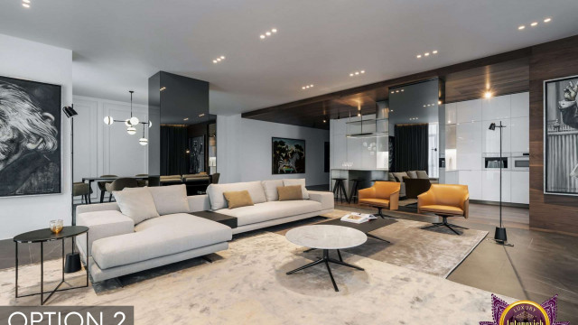 This picture shows a modern living room with a sleek, contemporary design. The main color palette consists of light gray and white, and there is plenty of natural light coming in through the tall windows. The walls are adorned with abstract art pieces, giving the room a unique, artistic look. The furniture is minimalistic, with a large sectional sofa dominating the center of the space. There is also a large round coffee table, which adds to the sophistication of the room. Overall, this living room has a very chic, inviting atmosphere.
