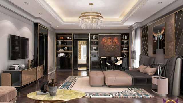 This picture shows a modern luxury living room designed by Antonovich Design. It features dark wood furniture, white walls, and a patterned rug with bold colors. The room has a contemporary feel, with an open floor plan and plenty of windows allowing in lots of natural light. There is an L-shaped couch with an ottoman and an oversized armchair, with an accent wall showcasing an abstract painting. The room also includes a bar area, with glass-front cabinets and wine storage.