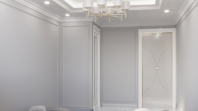 This picture shows a pristine, white marble lobby room in an upscale building. The walls and floor are made of polished marble and there is a large crystal chandelier hanging in the center of the room. Directly underneath it is an elegant wooden desk with a luxurious wallpaper on the wall behind it. To the left are two comfortable looking chairs with a small table between them. A large painting hangs on the wall to the right of the desk and there is a beautiful flower arrangement on the table near the door.
