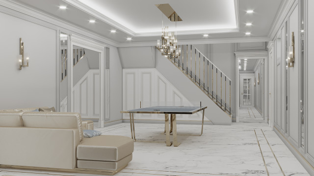 This picture shows a beautiful, ornate hallway in a luxurious residence. The hallway features a large crystal chandelier, marble flooring, and intricate gold designs on the walls and ceiling. It also has two balconies with stylish railings, as well as several busts lined up along the sides of the walls. The entire area exudes elegance and opulence.