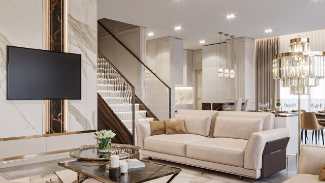 Modern living room featuring grey sectional sofa, white marble coffee table, ottoman, and abstract artwork.
