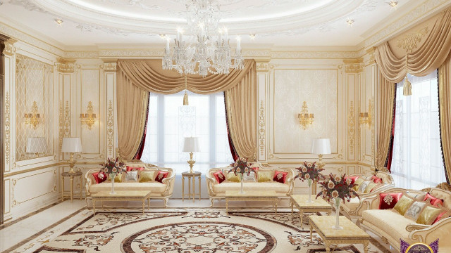 jpgThis picture shows an elegant living room with luxurious decor. The room has a marble floor, a large sofa decorated with cushions and throws, an armchair, and a coffee table with decorations. The walls are adorned with gold-framed artworks, and there is a crystal chandelier hanging from the ceiling. In addition, there is a patterned rug underneath the furniture to add warmth to the space.