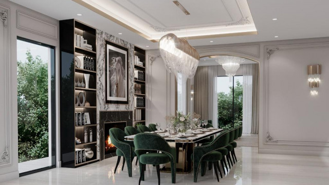 A contemporary dining room featuring a dark wood dining table, white leather chairs, and crystal chandelier.