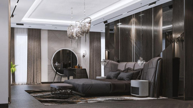 A luxury hotel lobby showcasing a sophisticated marble flooring with a two-tone monochromatic design, a large curved reception desk, and a seating area featuring white leather armchairs and black upholstered ottomans.