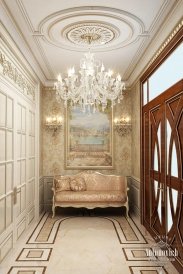 This picture shows a luxurious interior design inside a palace. It is composed of a grand staircase with a beautiful crystal chandelier, a grand dining area with elegant white furniture, and a luxurious marble flooring. The overall effect is one of opulence and sophistication.