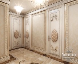 A luxurious white marble bathroom with an intricate ceiling design, gold features, and a deep soaking tub.