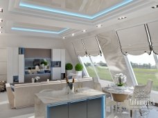 Modern luxury kitchen with two islands and a large window overlooking the garden.