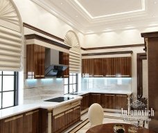 Luxury modest kitchen with marble top island and intricate lighting - perfect for contemporary home.
