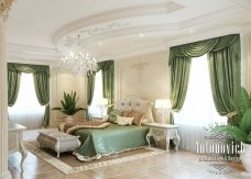 A luxurious living room with green interior design and elegant furniture, perfect for receiving guests in style.