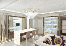 Interior design of an exquisite luxury living room with accent golden elements, elegant decor and modern furniture.